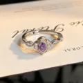 Close-up detail of silver open ring featuring a purple oval zircon with floral micro-set stones. - Purple Oval Flower Style (JZ5436) / Adjustable Open