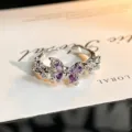 Detail shot of an exquisite open ring featuring purple zirconia butterfly stones. - Silver Purple Butterfly Style (JZ5519) / Adjustable Open