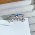 Stunning silver open ring featuring blue and pink cubic zirconia with dangling rhinestones. - Pink Blue Zirconia Paved Style (JZ0658A) / Silver