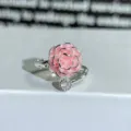 Detail view of a silver adjustable ring featuring a pink enamel flower and sparkling cubic zirconia. - Adjustable Open / Pink Enamel Camellia Style (JZ2139A)