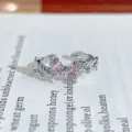 Close-up of a silver open ring with pink zircon crystals in a butterfly design, detailed view. - Butterfly Shape Style (JZ0828A)