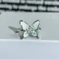 Detailed shot of a green enamel butterfly zircon open ring, dainty floral jewelry for women. - Adjustable Open / Green-White Enamel Butterfly Flower Style (JZ2533A)