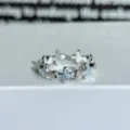 Silver open ring with light blue enamel flower motifs and sparkling zircons for daily wear. - Adjustable Open / Light Blue Enamel Four-Leaf Clover Style (JZ4153A)
