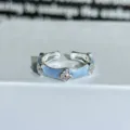 Detailed view of light blue enamel four-leaf clover ring with sparkling zirconia stones. - Adjustable Open / Light Blue Enamel Four-Leaf Clover Zirconia Style (JZ4916A)