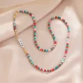 Colorful heishi clay bead necklace with gold spacers and love letter charms for daily wear. - Multifunctional Chain / Color 12
