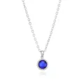 Close-up detail of the elegant blue gemstone pendant necklace showcasing delicate chain and sparkle. - Silver September
