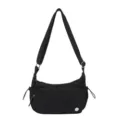 Borsa a tracolla da donna nera in nylon con diverse tasche con zip e cinghia. - Nero