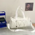 White gym duffel bag for sports, yoga, and travel, featuring large capacity and shoulder strap. - White