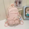 Pink nylon casual student backpack, cute solid color school bag with bow and pendant for daily use. - With Pendant / Pink