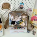 Clear PVC front window ita bag detail showing plush doll storage capacity and cute embroidery design. - Ita Bag (Single Bag) / Brown