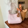 Chic pink shoulder bag for women, casual soft PU leather hobo bag with cute bear charm. - With Pendant / Pink