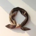 Detailed view of brown pleated square scarf, chic retro neck accessory for stylish wear. - 20