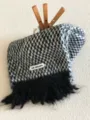Detail view of the soft black and white patterned winter fringe scarf with cozy texture. - Black