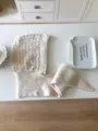 Cozy beige knit balaclava scarf combo with cable pattern and warm wool fabric in detail. - Ivory