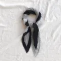Detailed view of the black and grey pleated silk scarf, elegant neckerchief for women. - 70x70cm / Black and Gray Pleated