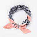 Detailed view of the stylish pleated polka dot neckerchief, showcasing delicate fabric. - Pleated Style / Polka Dot Pink