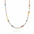 Close-up of bohemian colorful beaded necklace featuring a chic gold letter V pendant detail. - Letter V (NE0446 V)