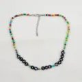 Collana di perline colorate con ciondoli lettere, gioielli bohémien alla moda per donne. - Stay in the magic