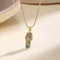 Gold necklace with enamel flip-flop pendant, evil eye motifs and sparkling cubic zirconia. - Yellow