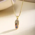 Gold evil eye slipper pendant necklace with sparkling rhinestones for women fashion detail view. - Pink