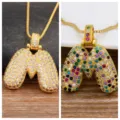 Gold-plated bubble letter pendant necklace with sparkling cubic zirconia for charming women. - M