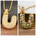 Gold-plated bubble letter U pendant necklace with colorful cubic zirconia stones, elegant jewelry. - Letter U