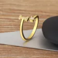 Gold plated open ring with micro-set cubic zirconia, simple adjustable fashion jewelry piece. - Letter I