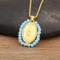 Vintage 18K vergulde ovale religieuze hangketting met prachtige lichtblauwe kralen. - Lichtblauw