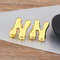 Golden puffy letter stud earrings, minimalist trendy smooth metallic jewelry for daily wear. - Letter N