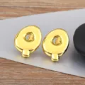 Gold letter Q bubble earrings for women and men, minimalist smooth metal fashion ear studs. - Letter Q