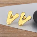 Gold bubble letter V earrings, minimalist glossy metal ear studs for women and men fashion style. - Letter V
