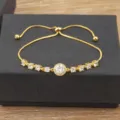 Elegante pulsera de tenis ajustable de circonita chapada en oro de 18k para mujer y regalo - Dorado