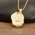 Gold-plated initial letter B pendant necklace with irregular geometric enamel design. - Letter B