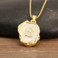 Gold-plated initial letter S pendant necklace with irregular geometric design and enamel. - S