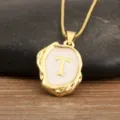 Gold plated letter T pendant necklace with white enamel irregular geometric design. - Letter T