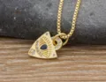 Detailed close-up of the gold-plated evil eye pendant necklace with sparkling cubic zirconia. - Gold