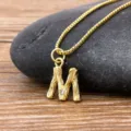 Minimalist 18K gold plated bamboo letter M pendant necklace with sparkling cubic zirconia stone. - Letter M