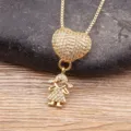 Gold-colored heart and girl charm pendant necklace with crystal pavé on wooden background. - White 1 Girl