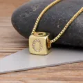 Gold plated cube letter O pendant necklace with sparkling cubic zirconia stones for women. - Letter O