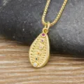 Gold-colored copper necklace with shell pendant and colorful zircon stones. Beach style. - Gold