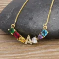 Gold-plated colorful gemstone alphabet necklace with sparkling cubic zirconia letter pendant. - Letter A