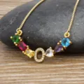 Gold plated colorful gemstone letter O pendant necklace featuring sparkling cubic zirconia charms. - Letter O