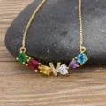 Gold-plated copper initial necklace with colorful zirconia stones and letter pendant. - Letter V