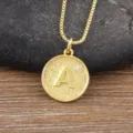 Gold-toned initial letter A pendant necklace with sparkling cubic zirconia on box chain. - Letter A