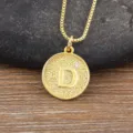 Gold-plated initial D pendant necklace with sparkling zircon on textured round disc jewelry. - Letter D