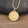 Gold plated letter Q pendant necklace with sparkling cubic zirconia on a chic coin charm. - Letter Q