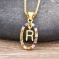 Gold-plated letter R pendant necklace featuring sparkling multicolored cubic zirconia stones. - Letter R