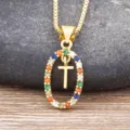 Gold-tone multi-color zircon oval pendant necklace with a cross design and elegant clavicle chain. - Letter T