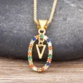 Gold-plated necklace featuring a colorful zircon paved oval pendant with a letter V charm. - Letter V