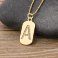 Gold-plated initial letter A pendant necklace with sparkling cubic zirconia on box chain. - Letter A